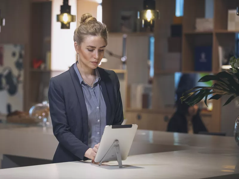 Bank hostess with tablet
