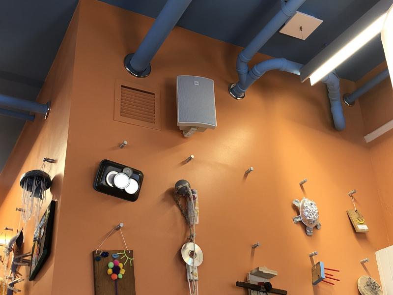 Cabinet speaker on wall of children's museum