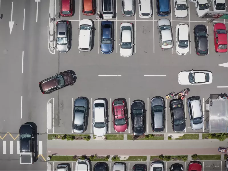 Parking lot from above with cars