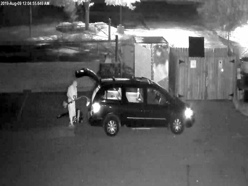 Night time surveillance photo taken from video of theft