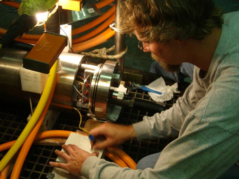 Scientist on boat monitors depth of ROV