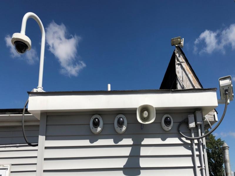 Cameras and speakers on roof eave