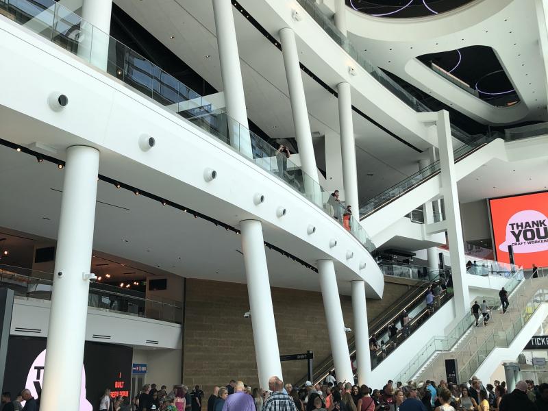 Fans standing in line leading up stairs of the Fiserv Forum