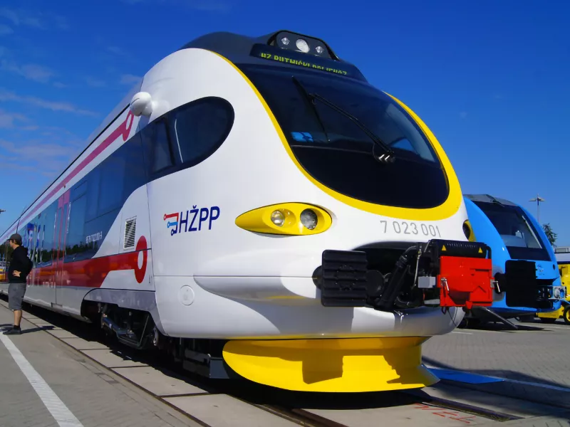 Modern train at platform with blue sky background