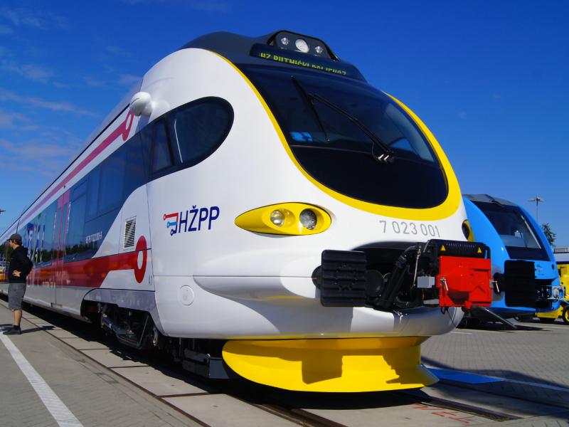 Modern train at platform with blue sky background