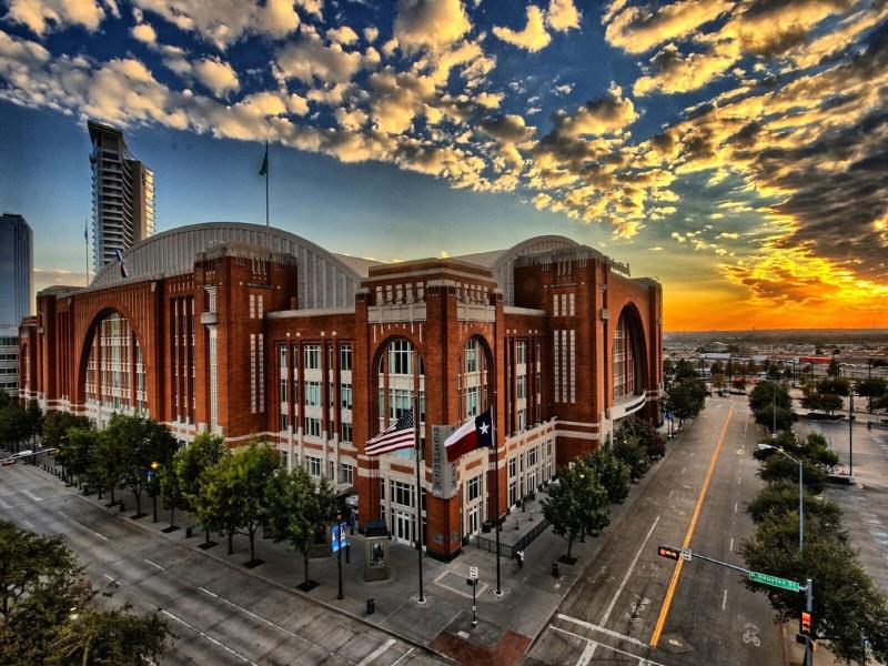 Different angle of American Airlines Center at sunset