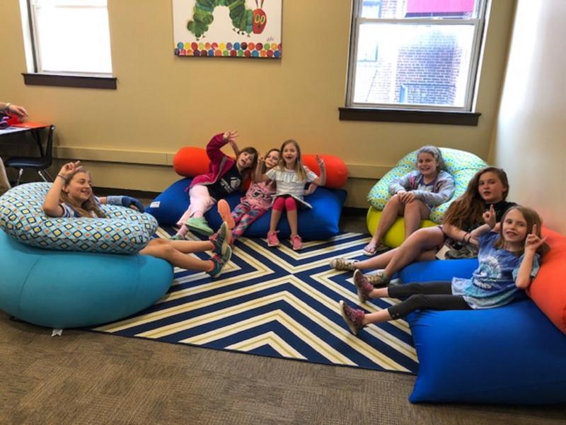Kids in book knook of Boys and Girls Club