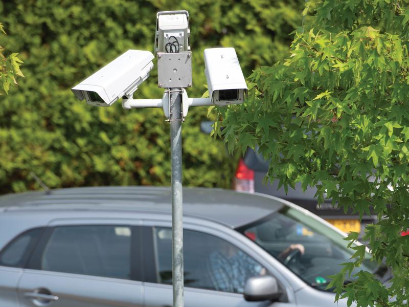Pole cameras overlooking parking lot