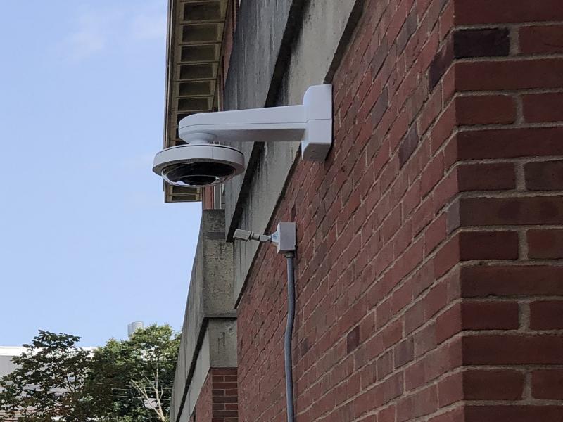 Camera on exterior wall of campus building