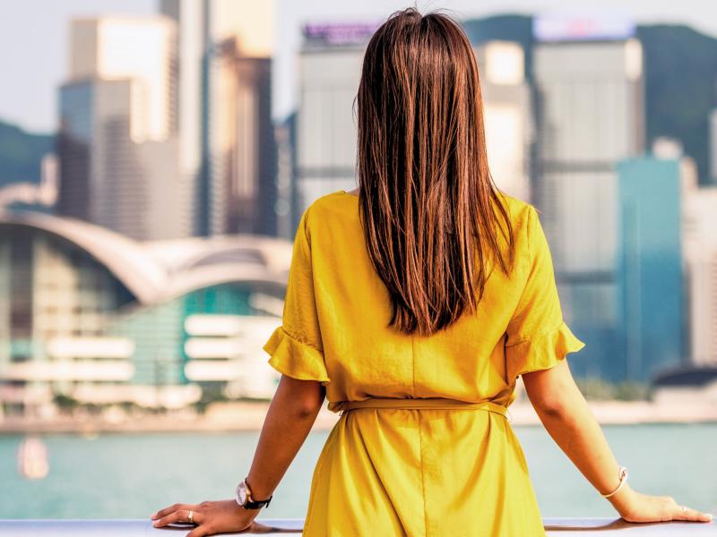 Woman looking out over a city