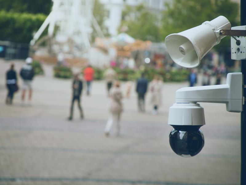 c1310e and q1655ee mounted on a pole in a city square