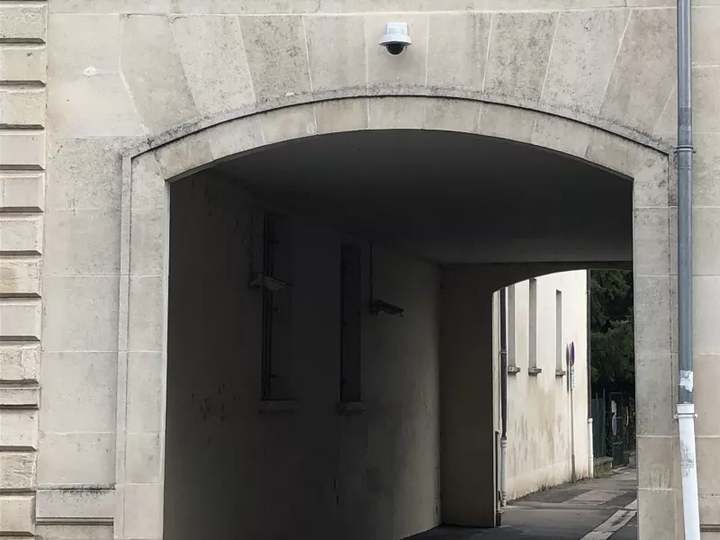 Wall mounted camera above archway