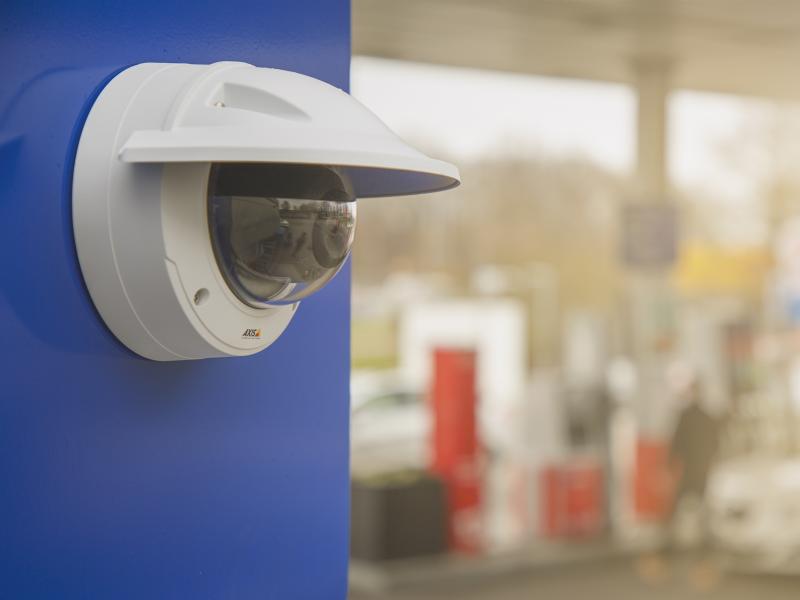 Axis camera mounted on wall at gas station.