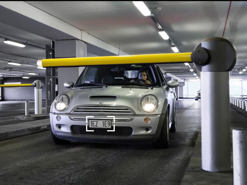 White car in a parking garage