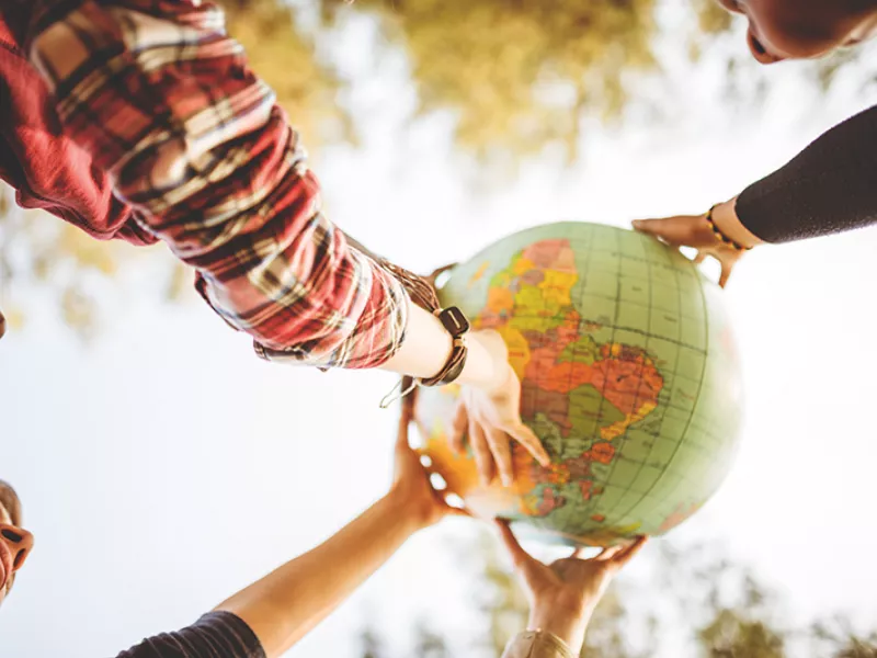 Globe with hands