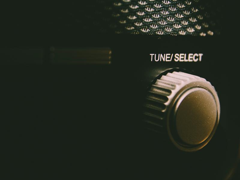 Tune/select button, in light color. Black color in the background.