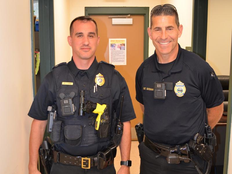 Two Auburn police officers wearing Axis body worn cameras