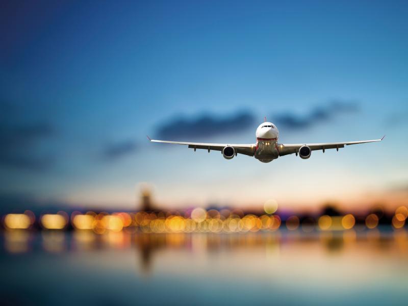 Airplane takeoff in blurry night background