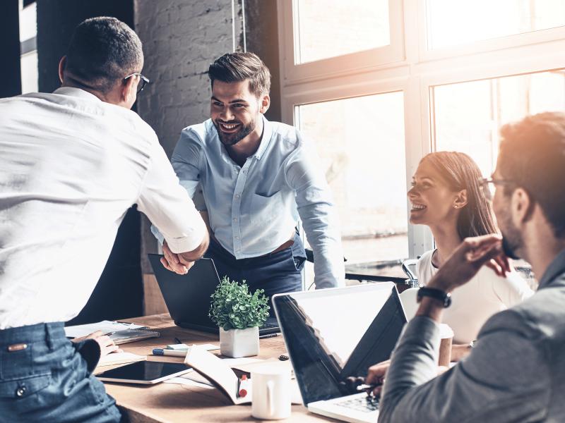 Men shaking hands at a business meeting