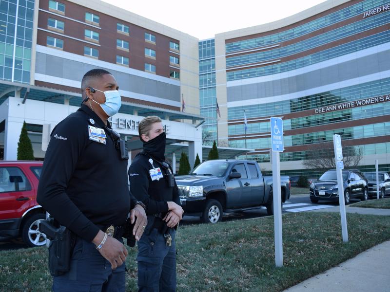 2 security officers in front of hospital