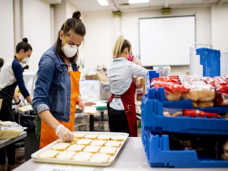 3 women working in kitchen of soup kitchen
