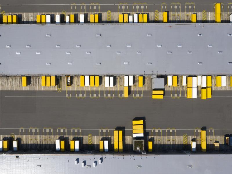 cargo containers in yellow and white color, seen from above