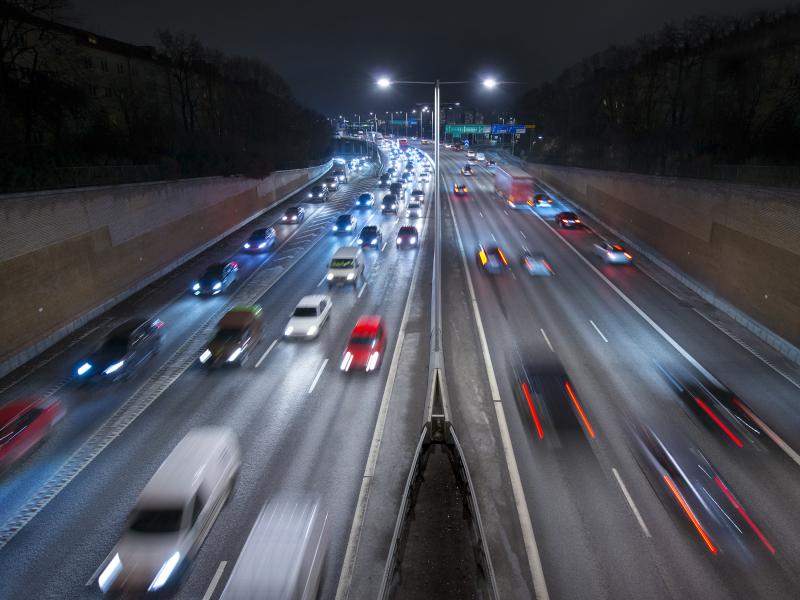 trafficed highway at night