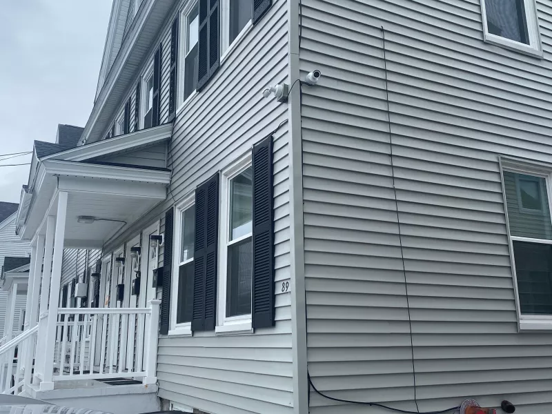 Corner of transitional housing complex showing exterior cameras