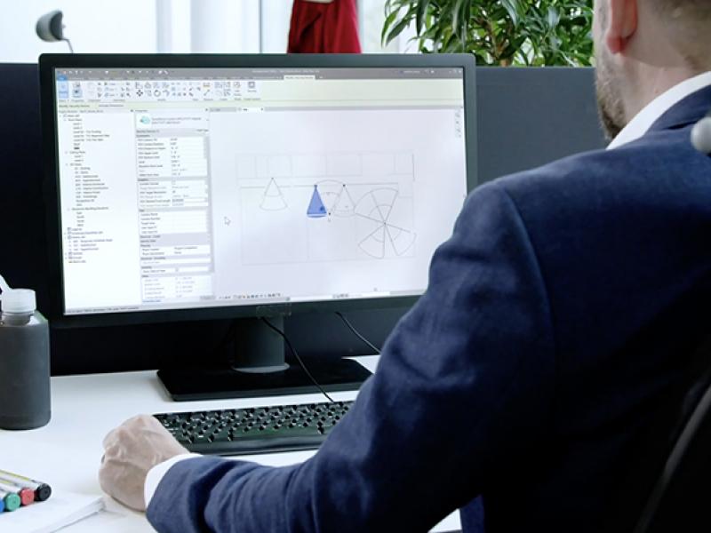 Man and computer screen.