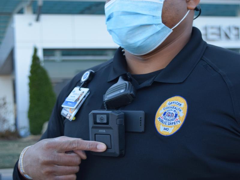 CoxHealth officer depresses body worn camera button