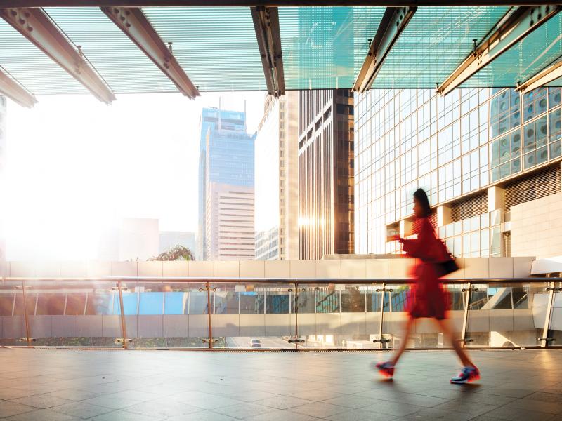 Woman walking on walkway