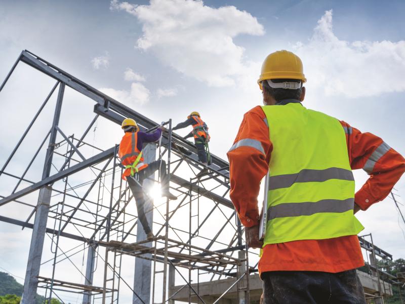 Man at construction site wearing a high visibility vest