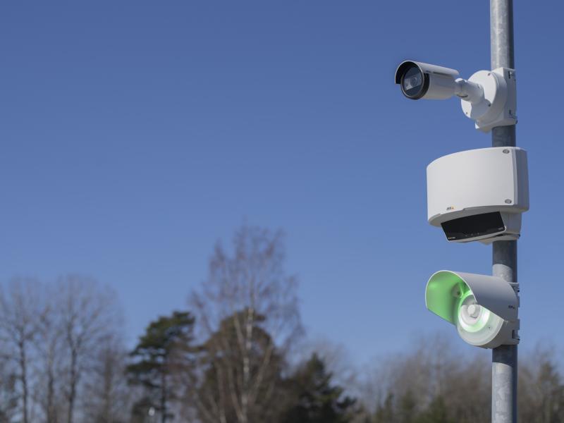 Speed monitor mounted on a pole, blue skies in the background