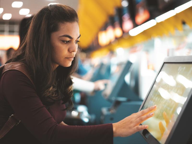 Woman using screen in airport