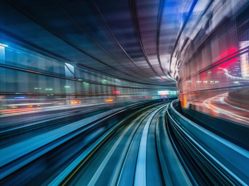 High speed train in tunnel at night.