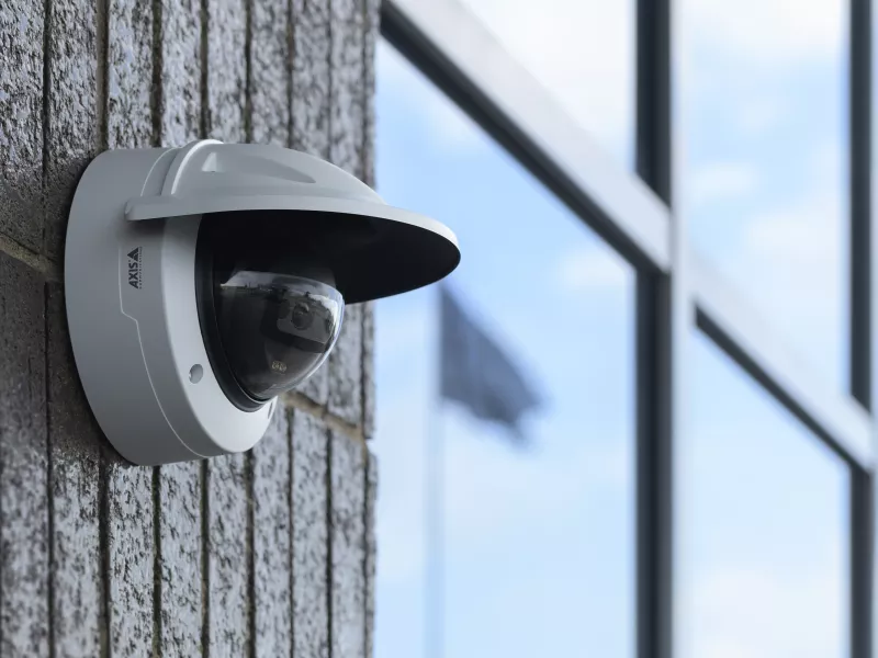 M3215-LVE wall mount outside with blue sky.