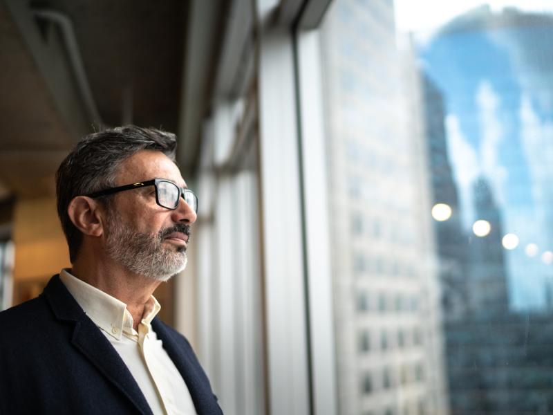 older businessman, looking out of the window