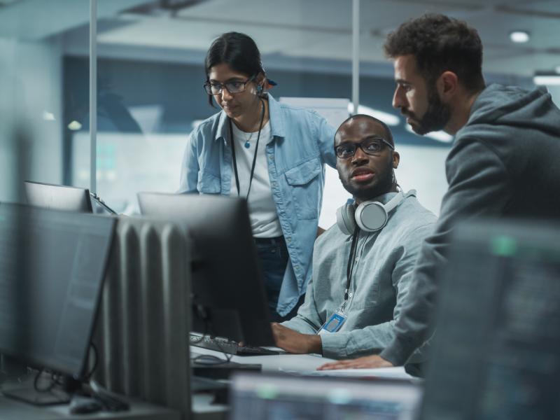 Teamwork at office around computer.