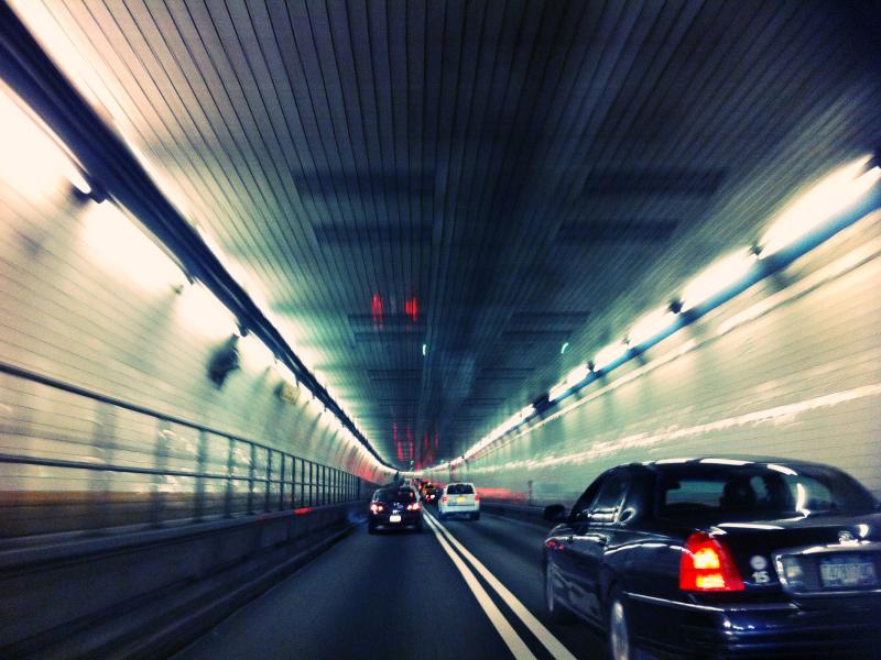 cars in motion in a traffic tunnel