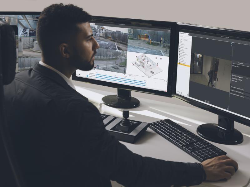 Operator by computer, working with security.