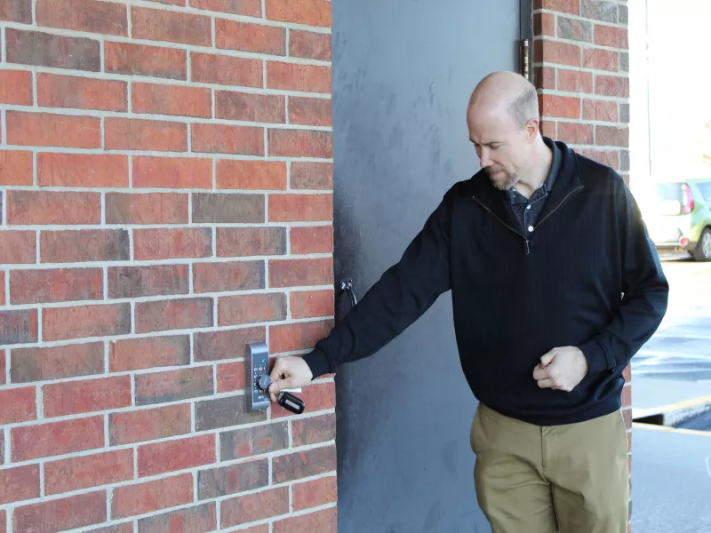 Door station with man swiping card reader