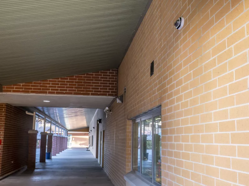 Exterior wall with overhang and camera
