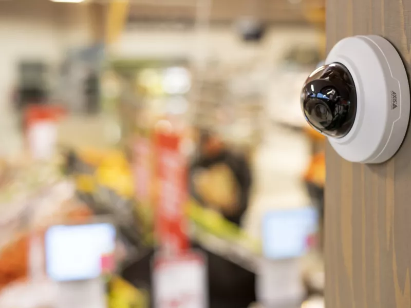 AXIS M421815/18-LV installed wall-mounted in grocery store