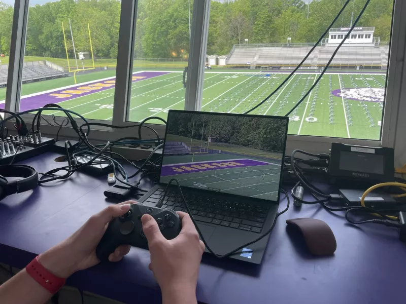 Close up of camera operator hands and monitor