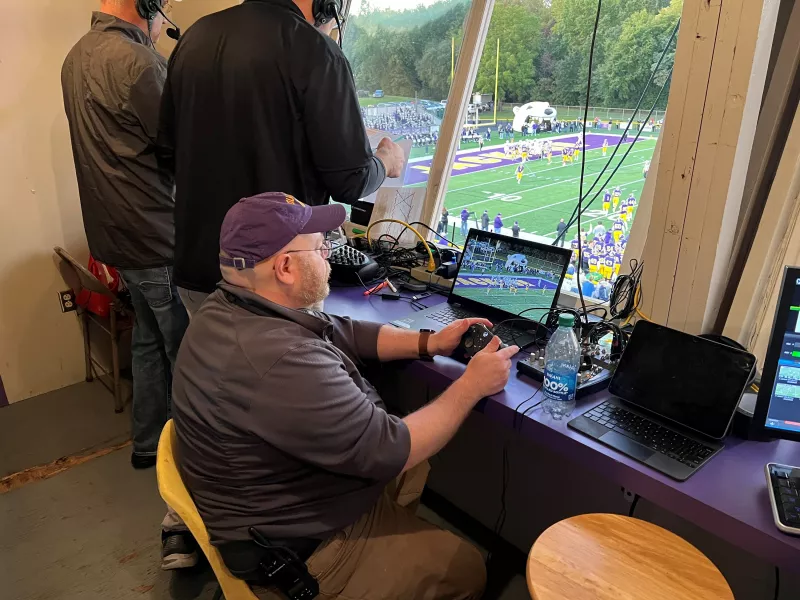 Camera operator in press box