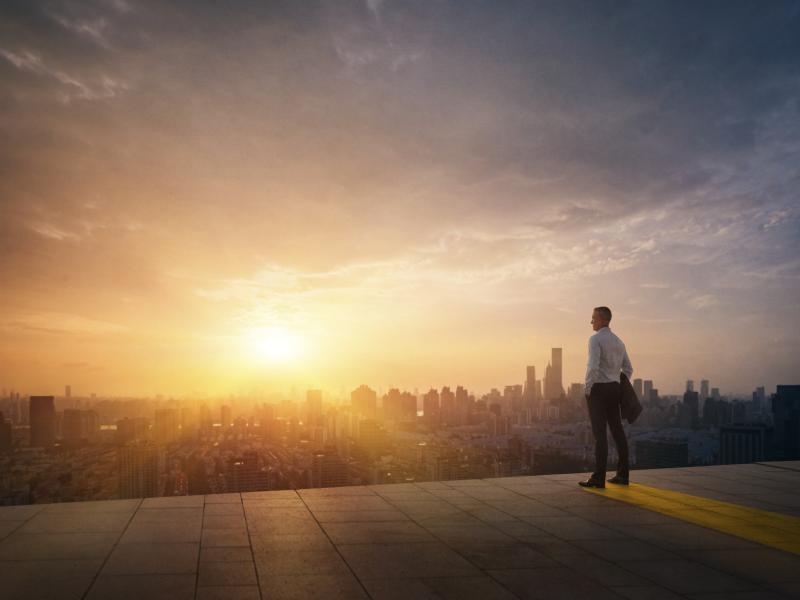 Person looking over a city skyline