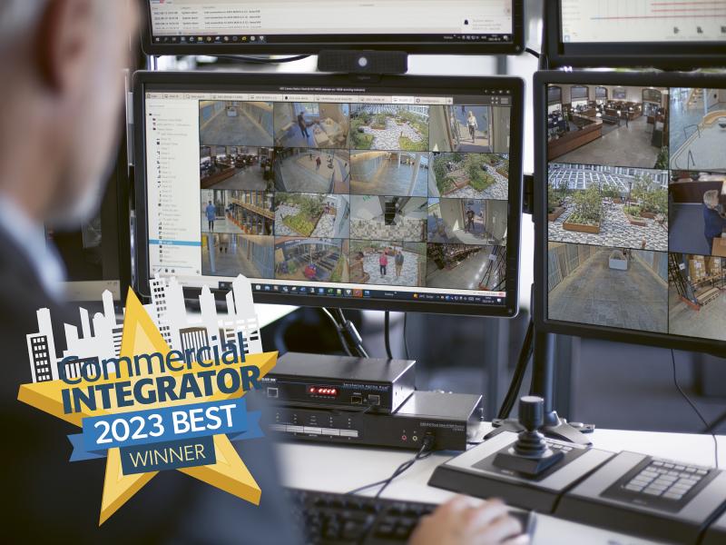 AXIS Camera Station operator with a fore ground of commercial integrator award winning embleme