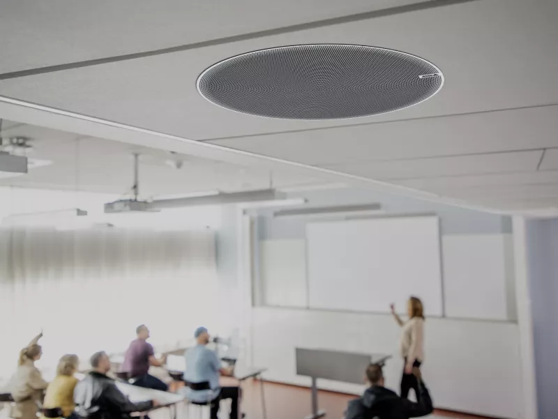 AXIS C1219-E placed in the ceiling in a classroom