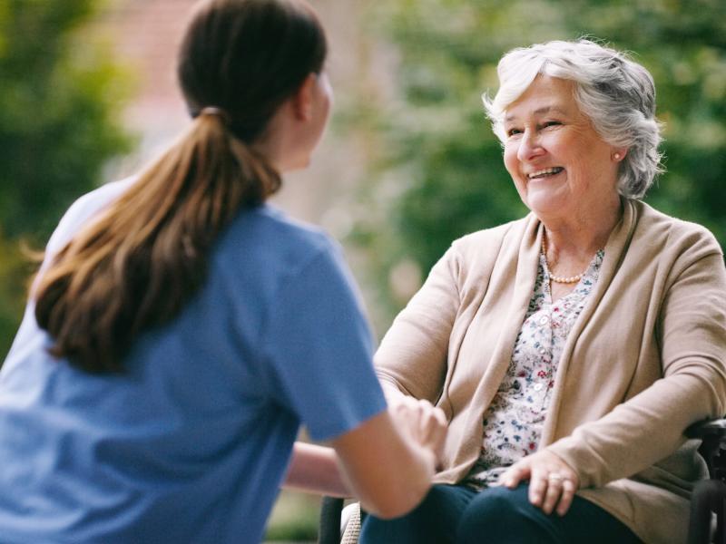 2women nurse elderly woman wheelchair 2309 hi