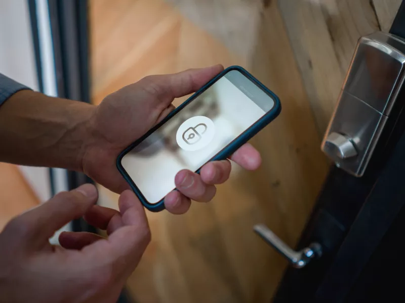 Hands phone mobile padlock access door